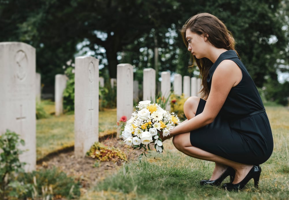 Grieving female at a graveside
