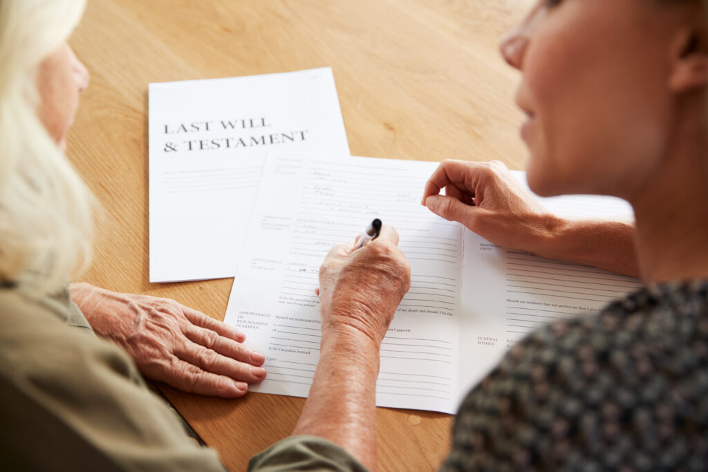 female friend helping senior woman complete