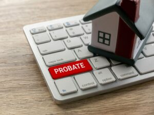 Probate Process Concept with Keyboard and House Model for Legal Real Estate Context