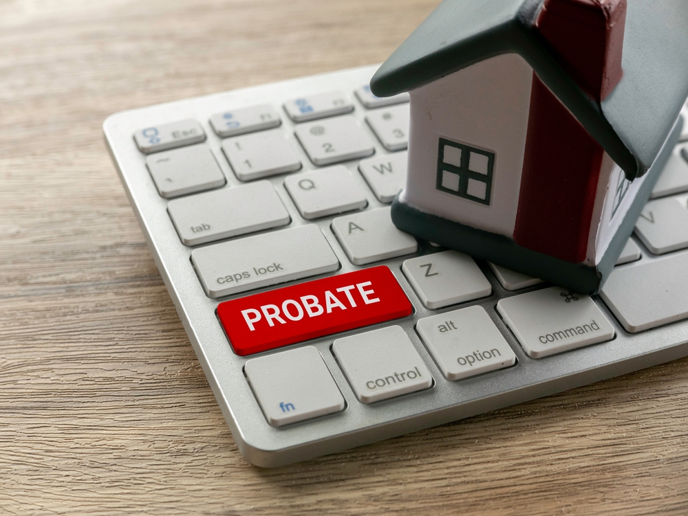 Probate Process Concept with Keyboard and House Model for Legal Real Estate Context