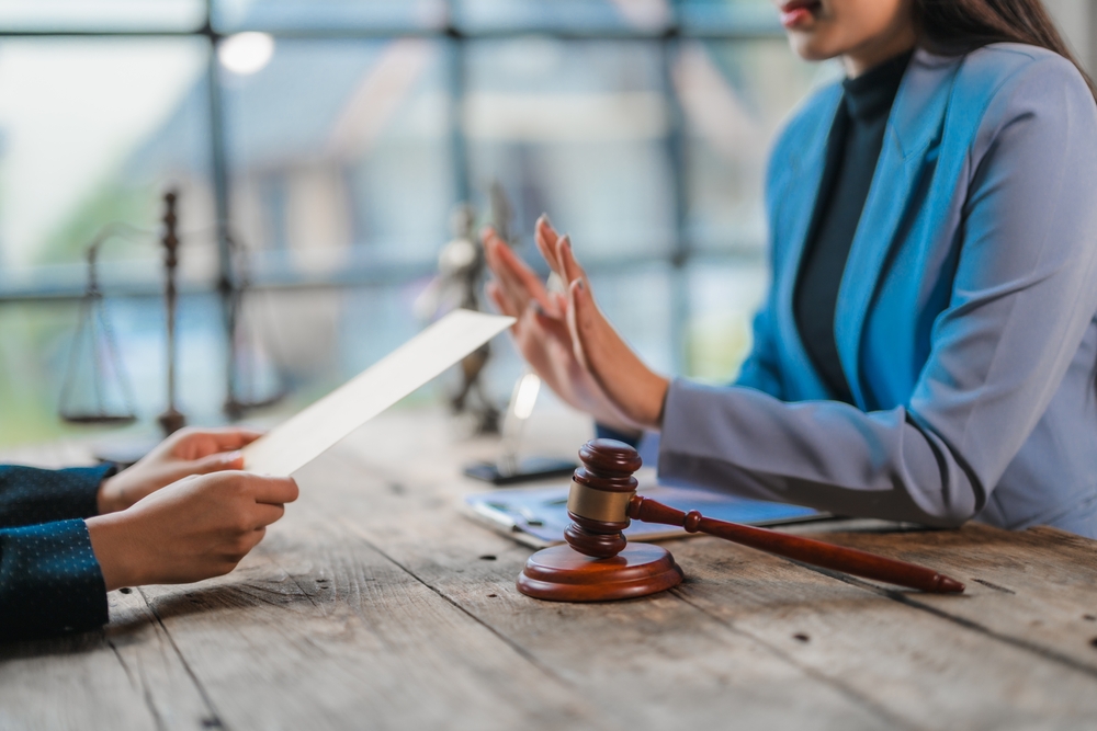 Lawyer is rejecting document proposed by client during meeting in law firm